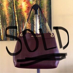 Michael Kors tote in Merlot color, pebble leather with gold tone hardware.